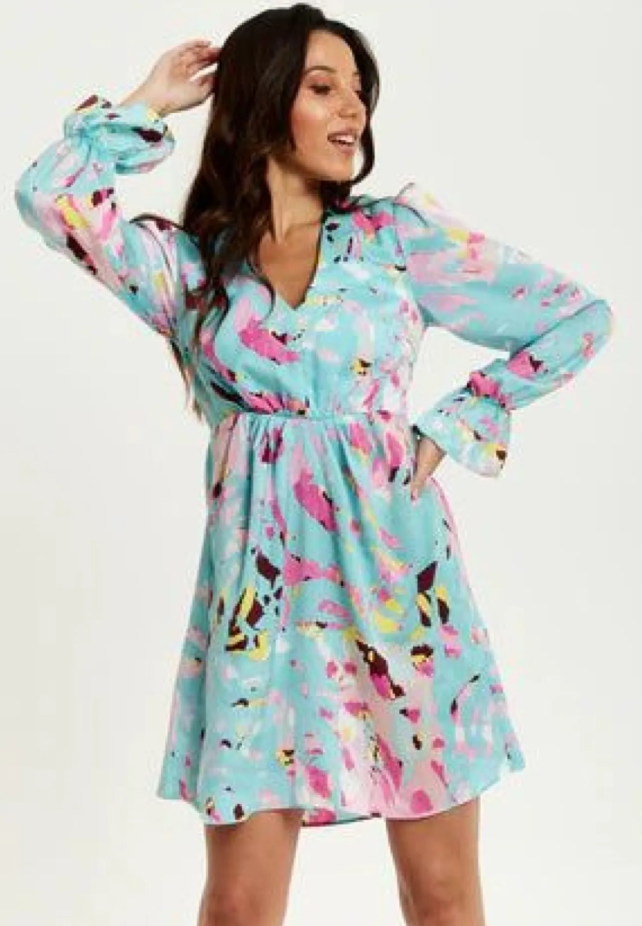 Women Liquorish Abstract Print Mini Dress With Open Back And Long Sleeves