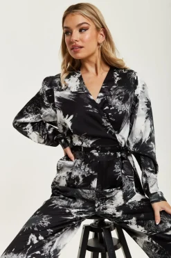 Women Liquorish Mono Abstract Print Jumpsuit With Long Sleeves